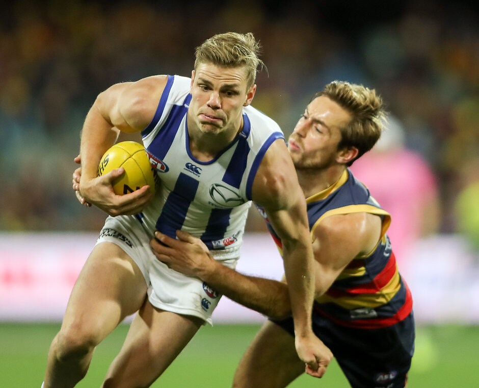 AFL 2016 Rd 14 - Adelaide v North Melbourne ADELAIDE, AUSTRALIA - JUNE 23: Mason Wood of the Kangaroos tackled by Richard Douglas of the Crows during the 2016 AFL Round 14 match between the Adelaide Crows and the North Melbourne Kangaroos at the Adelaide Oval on June 23, 2016 in Adelaide, Australia. (Photo by AFL Media)
